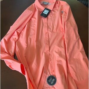 Peach colored button up active top.